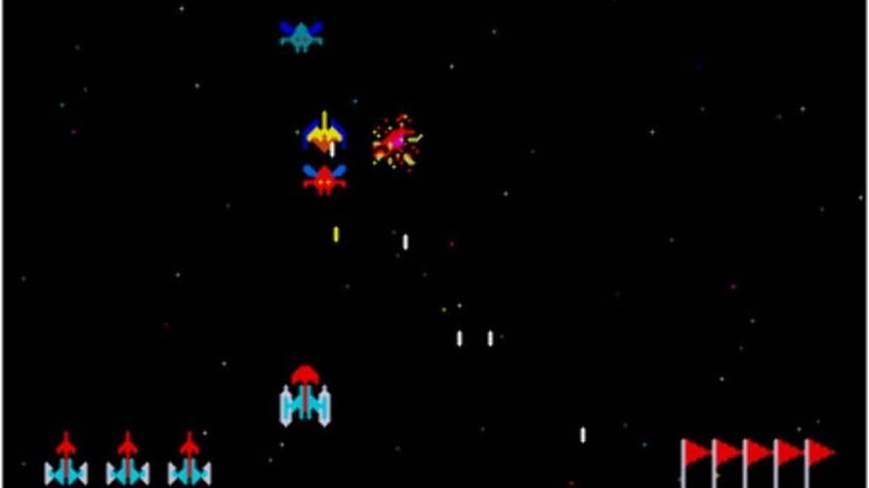 A spaceship blasts incoming enemy ships in Galaxian