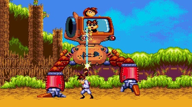 Gunstar Red blasts enemies piloting a two-legged mech in Gunstar Heroes