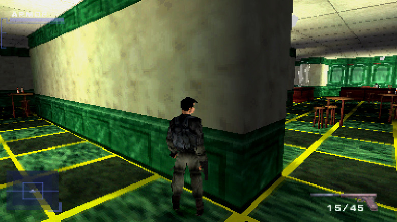 Gabriel Logan walks through a green-tiled corridor in Syphon Filter