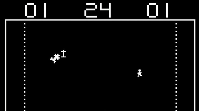 A car narrowly avoids a tombstone while a gremlin runs on the right side of the screen in Death Race