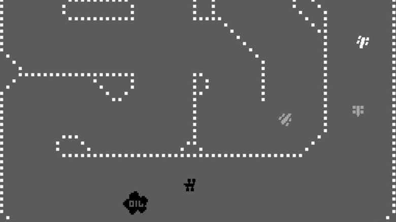 Cars move around a race track with an oil slick on the road in Sprint 2