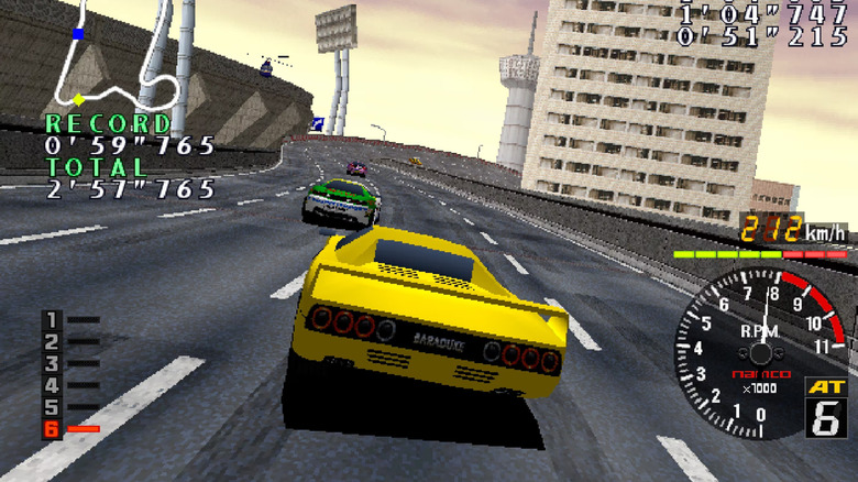 A yellow race car takes a corner on a race track in Rave Racer