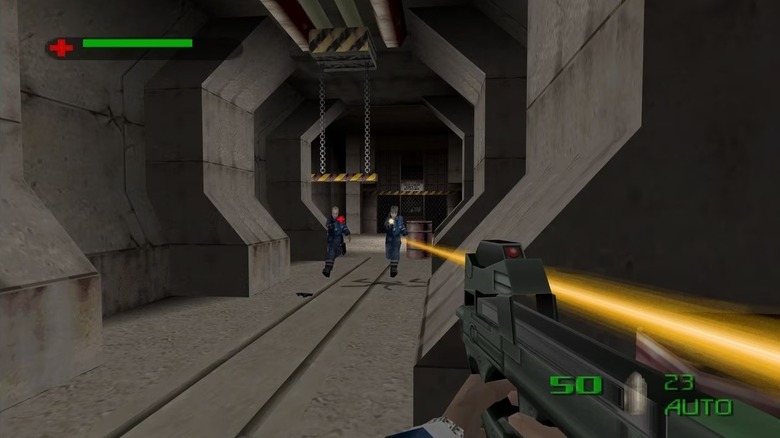 Two gunmen fire at James Bond as they run down an underground tunnel in The World Is Not Enough