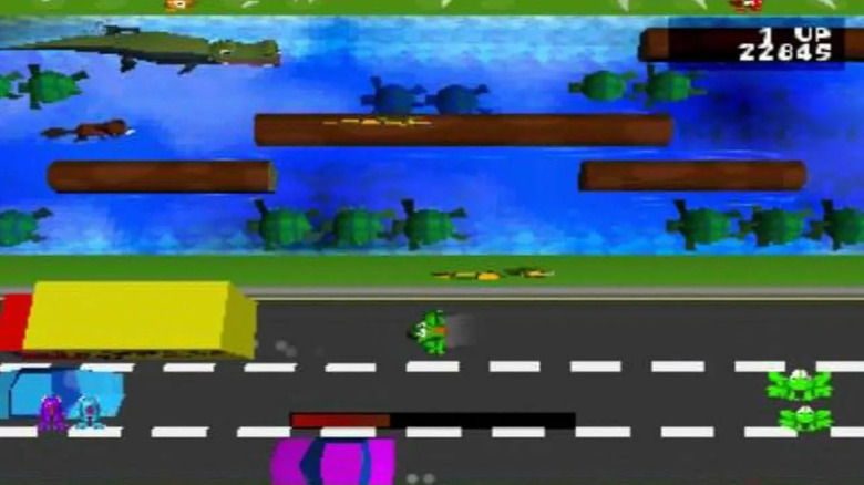 A frog moves down a busy street by a river in Frogger (1997)