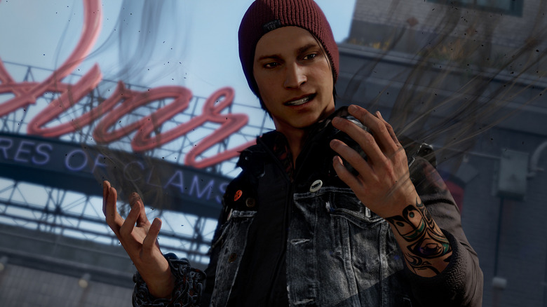 Delsin Rowe glances at his smoking hands in "Infamous Second Son" (2014)