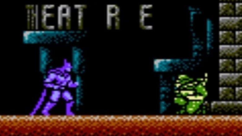 Batman approaches a crouching enemy in "Batman: The Video Game" (1989)