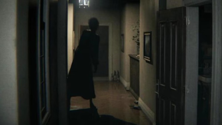 Lisa peers around a darkened corner in "P.T." (2014)