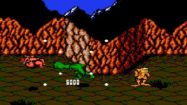 Rash punches an enemy while Zitz stands nearby in Battletoads (1991)