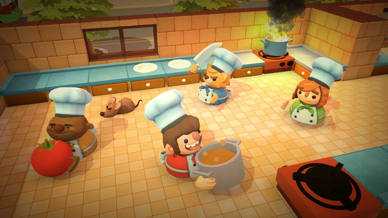 Four players navigate a kitchen together in Overcooked