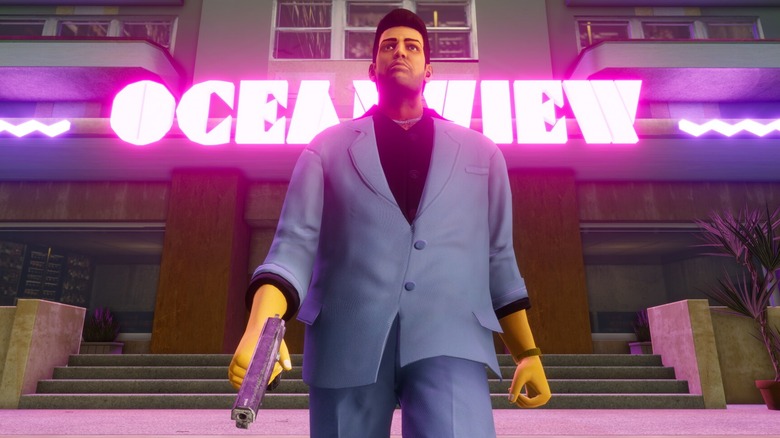 Tommy wearing blue suit and holding gun in GTA: Vice City
