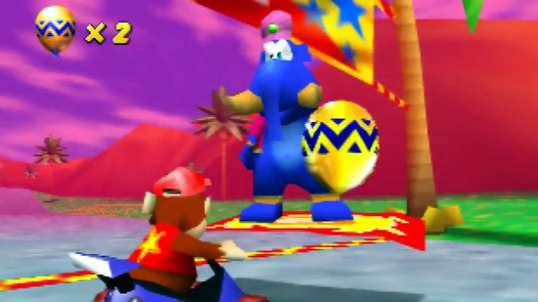 Taj gives Diddy Kong a golden balloon in Diddy Kong Racing