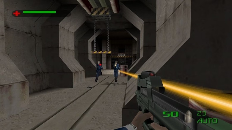 James Bond aims an assault rifle at two enemies firing at him in The World Is Not Enough