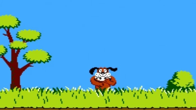 A dog rises from tall grass to laugh hysterically in Duck Hunt