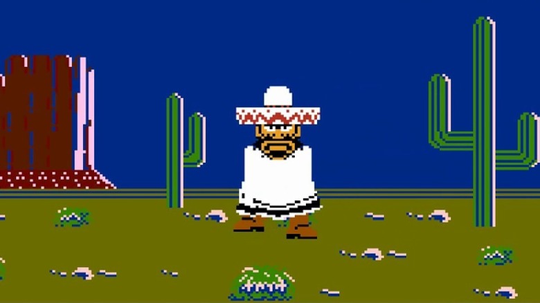 A glaring gunfighter stands by a cactus wearing a sombrero and poncho in Wild Gunman