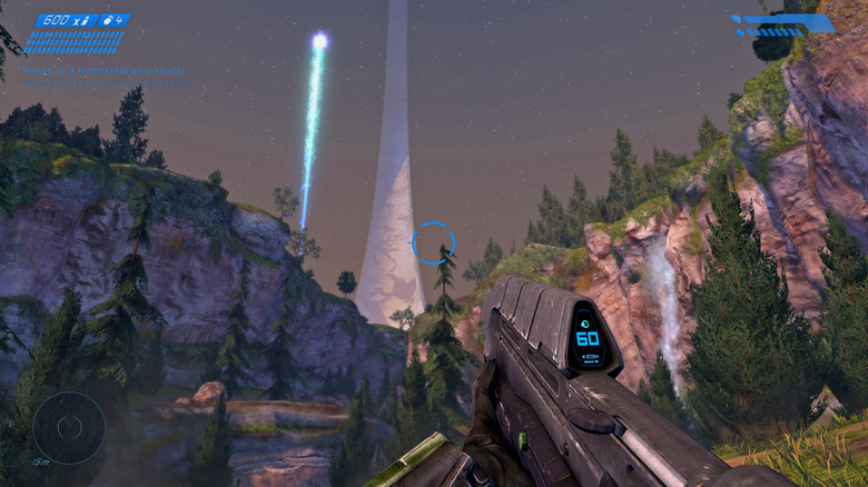 Master Chief aims his assault rifle on the horizon in Halo: Combat Evolved