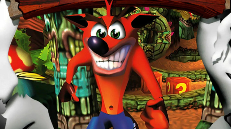 Crash Bandicoot bursts through a paper wall on the cover art for "Crash Bandicoot" (1996)