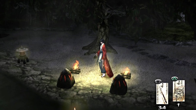 Sakuya standing between two bonfires in Kuon