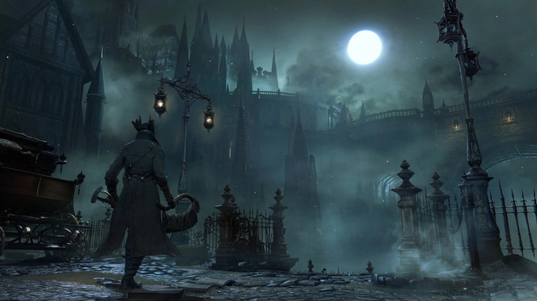 The Hunter walks through a foggy, empty city at night in Bloodborne