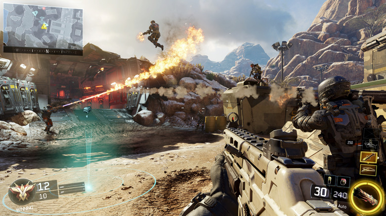 A group of soldiers attack each other by a rocky hill in Call of Duty: Black Ops III