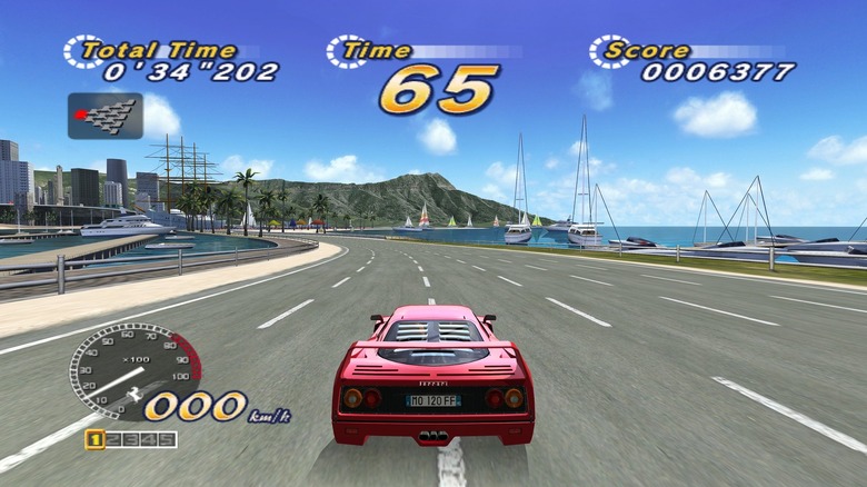 A red car races alongside a scenic coastline in OutRun 2006: Coast 2 Coast