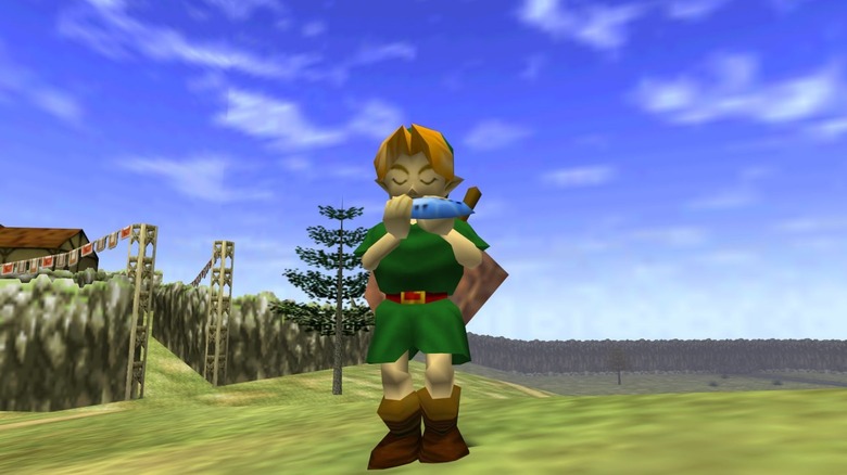 Link plays an ocarina in the middle of a field in The Legend of Zelda: Ocarina of Time