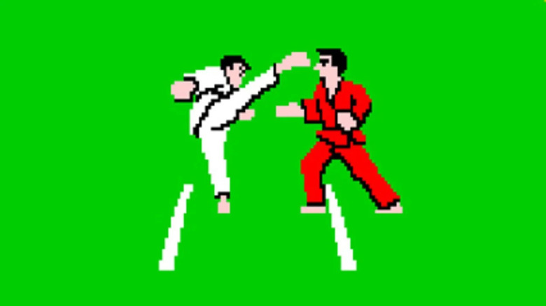 A fighter in a white gi kicks a fighter in a red gi in Karate Champ