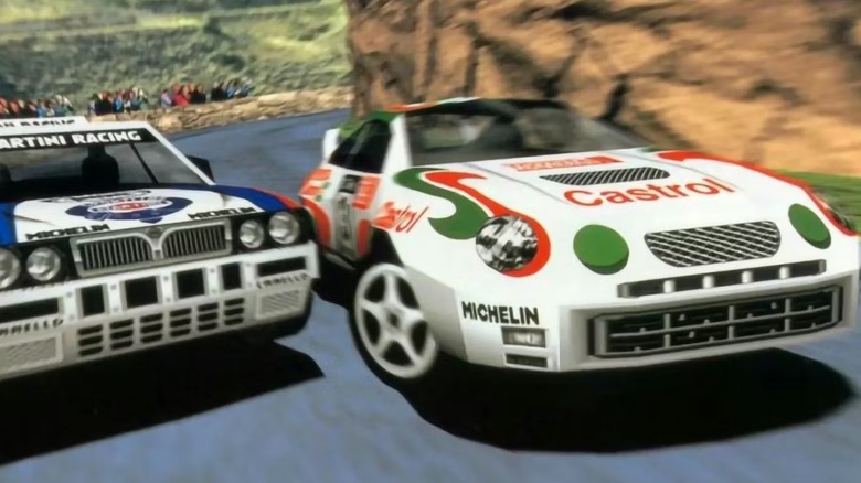 Two sports cars turn a rocky corner in Sega Rally Championship