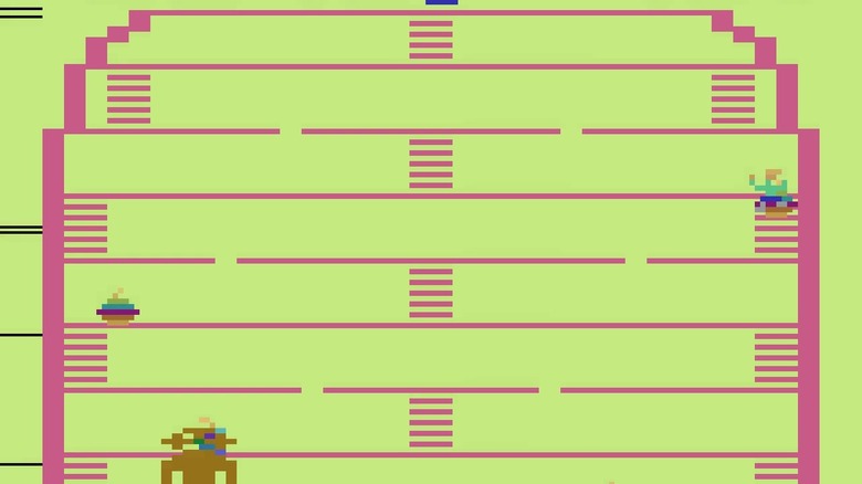 The player character climbs a ladder with King Kong at the bottom of the screen in King Kong