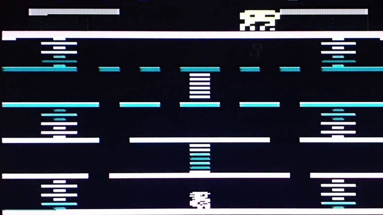 The player character moves along the bottom of the screen while an octopus looms overhead in Pac-Kong