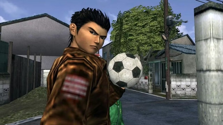 Ryo Hazuki looks back sternly while holding a soccer ball in Shenmue