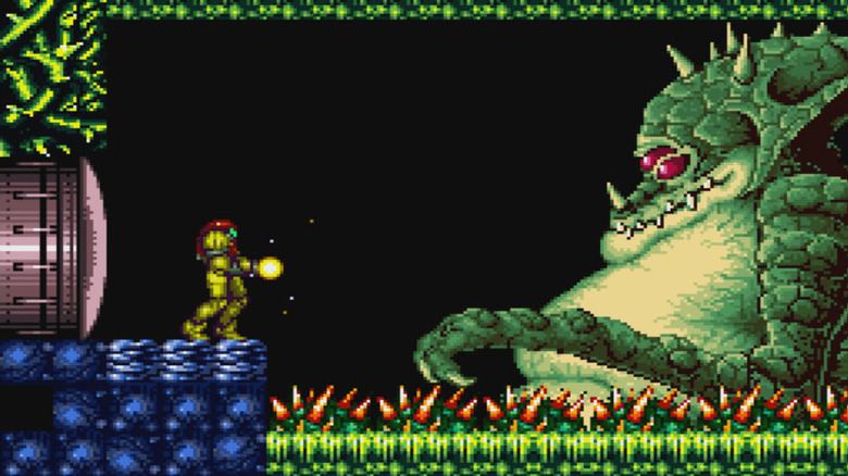 Samus Aran charges up a laser while facing Kraid in "Super Metroid" (1994)