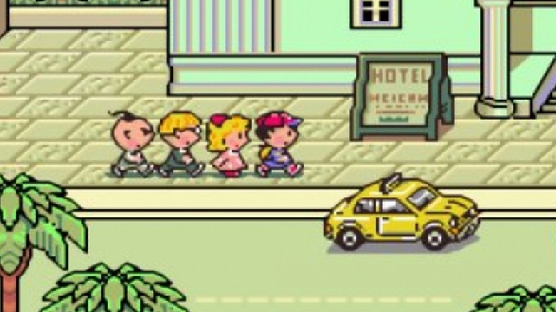 Ness and his friends walk outside of a hotel in EarthBound
