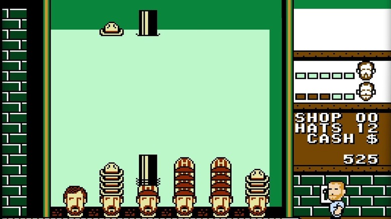 A pair of hats descend on men wearing stacked hats in Hatris