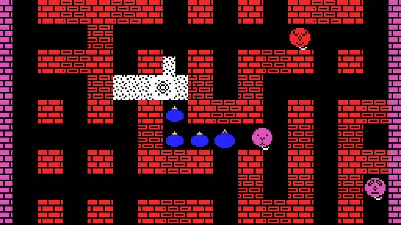 A trail of blue bombs within brick corridors populated by balloons in Bomberman