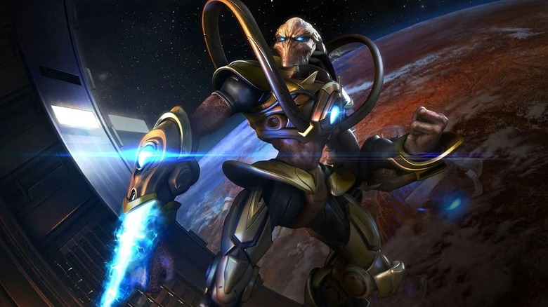 A Protoss ignites his psionic blade over a planet in promo art for StarCraft
