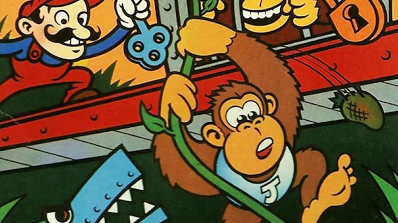 Donkey Kong Jr. swings on a vine as Mario holds a key over him on the cover of "Donkey Kong Jr." (1982)