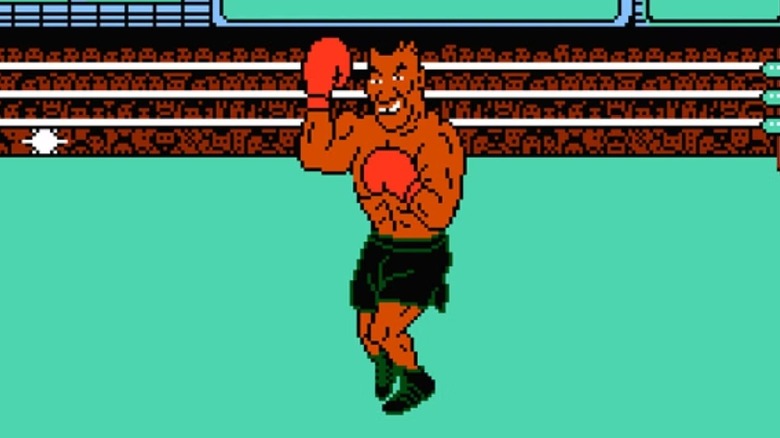 Mike Tyson holds up a fist triumphantly in Mike Tyson's Punch-Out!!