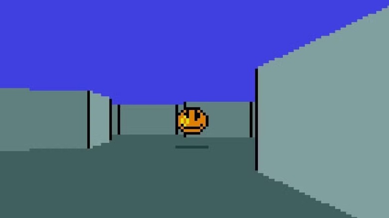 A player aims at a yellow smiley face in a gray maze in MIDI Maze