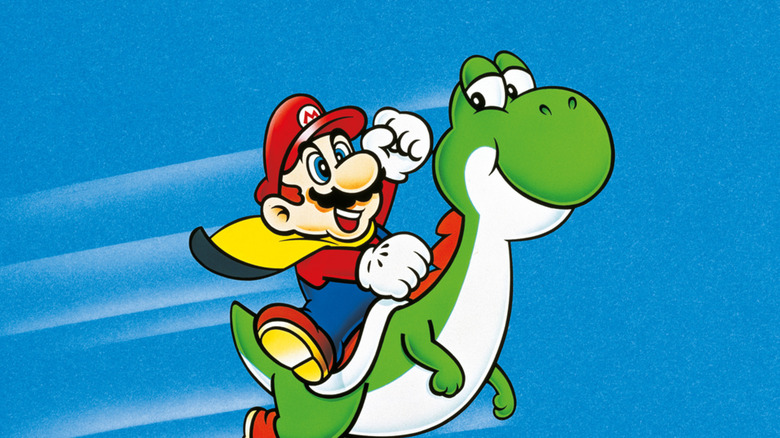 Mario raises his fist triumphantly while riding Yoshi on the cover art for Super Mario World