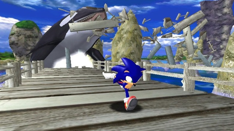 Sonic the Hedgehog is pursued by an orca on wooden docks in Sonic Adventure