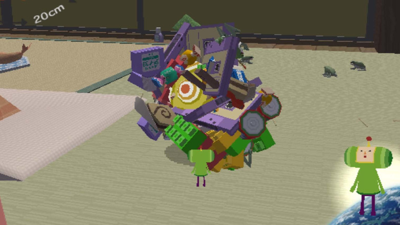 The Prince rolls a ball of items through a living room in Katamari Damacy