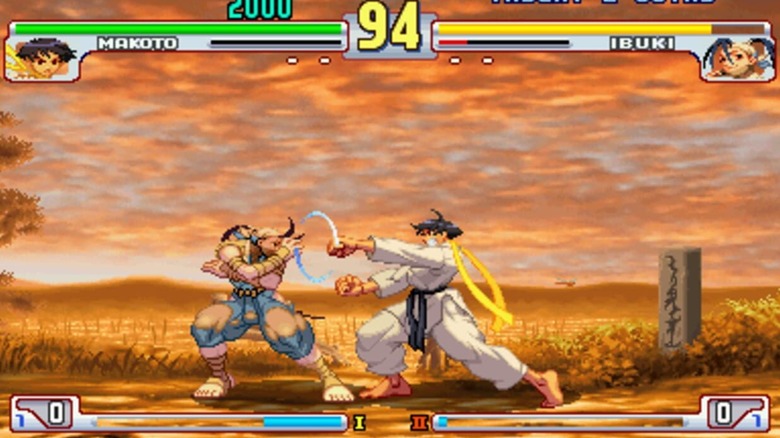 Ibuki and Makoto fight each other on a dirt road in "Street Fighter III: 3rd Strike" (1999)