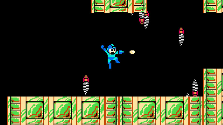 Mega Man leaps and blasts his arm cannon in Mega Man 2