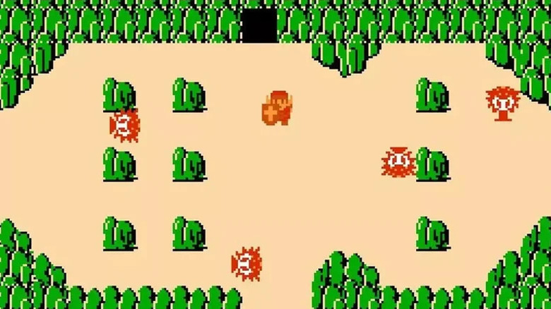Link exits a cave surrounded by boulders and octaroks in The Legend of Zelda