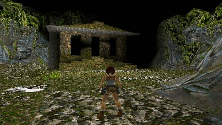 Lara Croft approaches an abandoned temple in the mountains in Tomb Raider (1996)