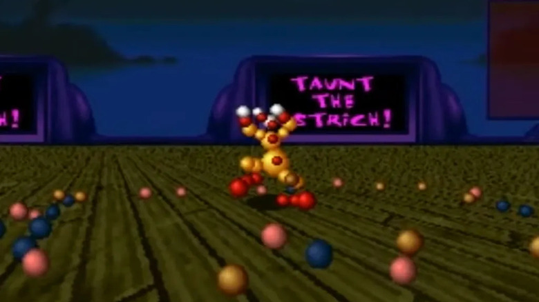 A fighter made of 3D balls strikes a pose on a wooden floor in Ballz 3D