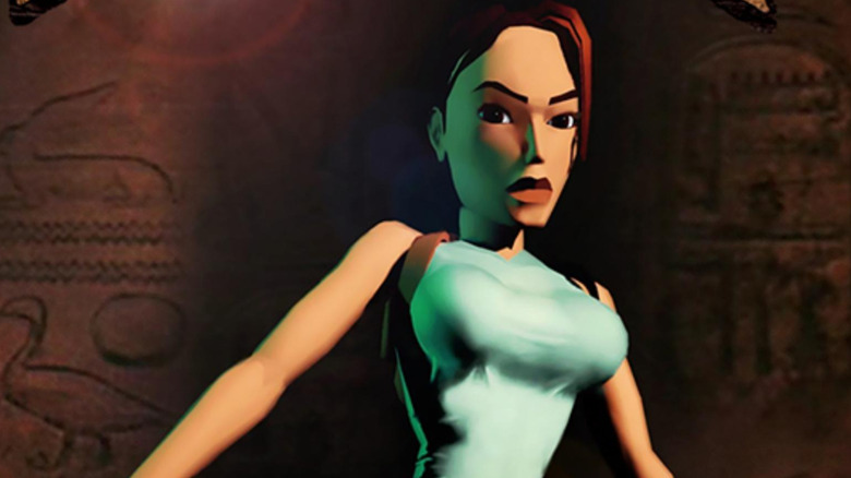 Lara Croft stands in an Egyptian tomb on the cover art for Tomb Raider (1996)