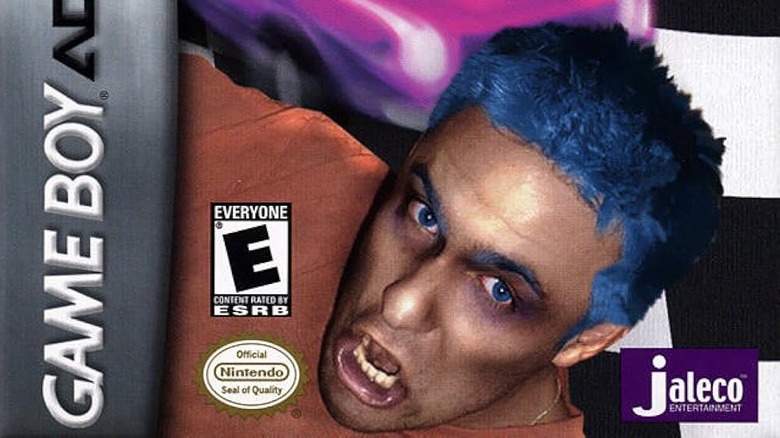 A man with dyed blue hair screaming on the cover for Karnaaj Rally