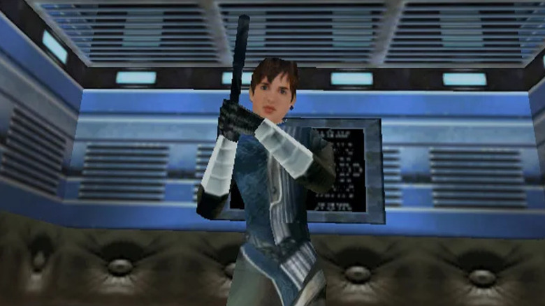 Joanna Dark holds a pistol in an elevator in "Perfect Dark" (2000)
