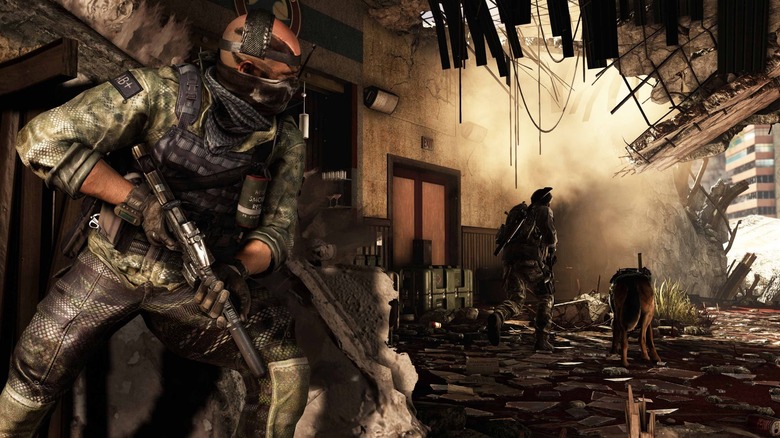 A soldier peering around a corner in a wrecked building in Call of Duty: Ghosts